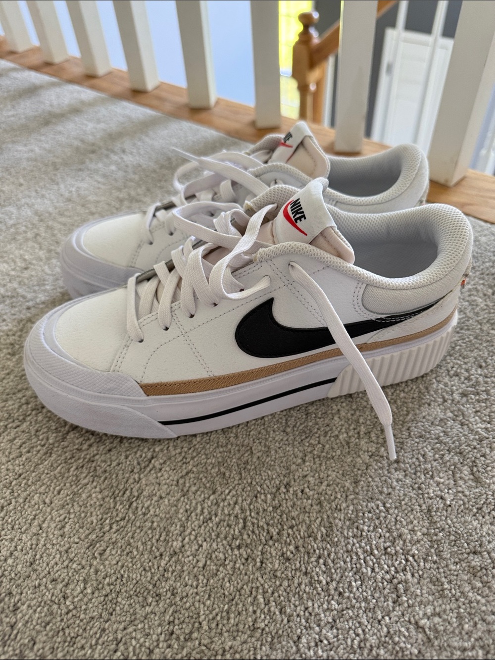 Nike Women's White Sneakers with Black Swoosh and Tan Accent